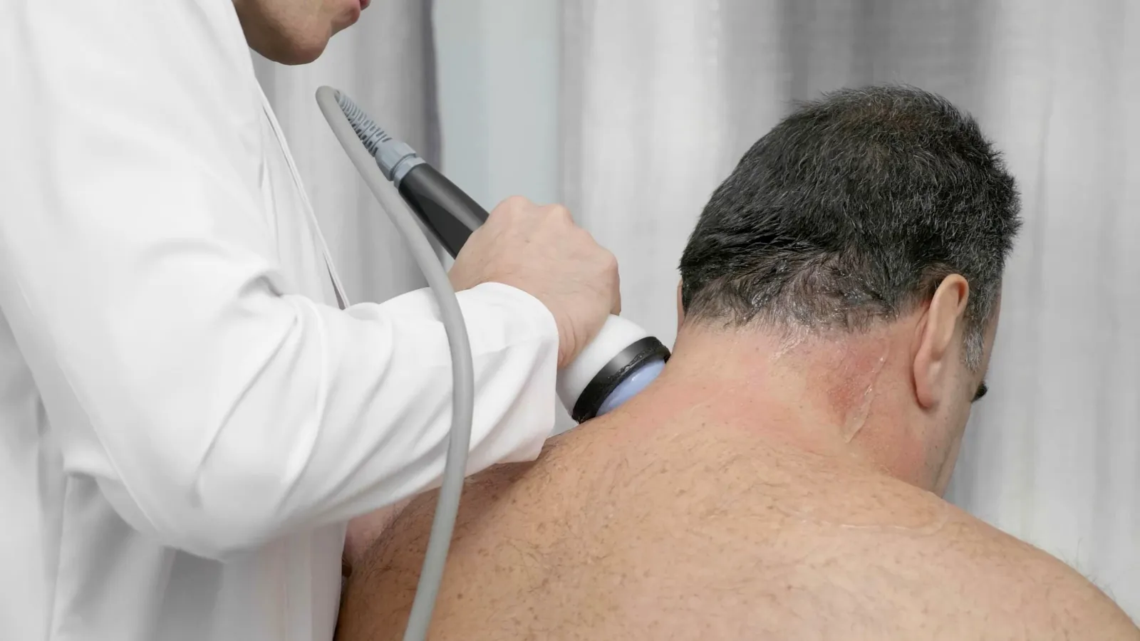 Stem Wave Therapy applied to the neck and upper back